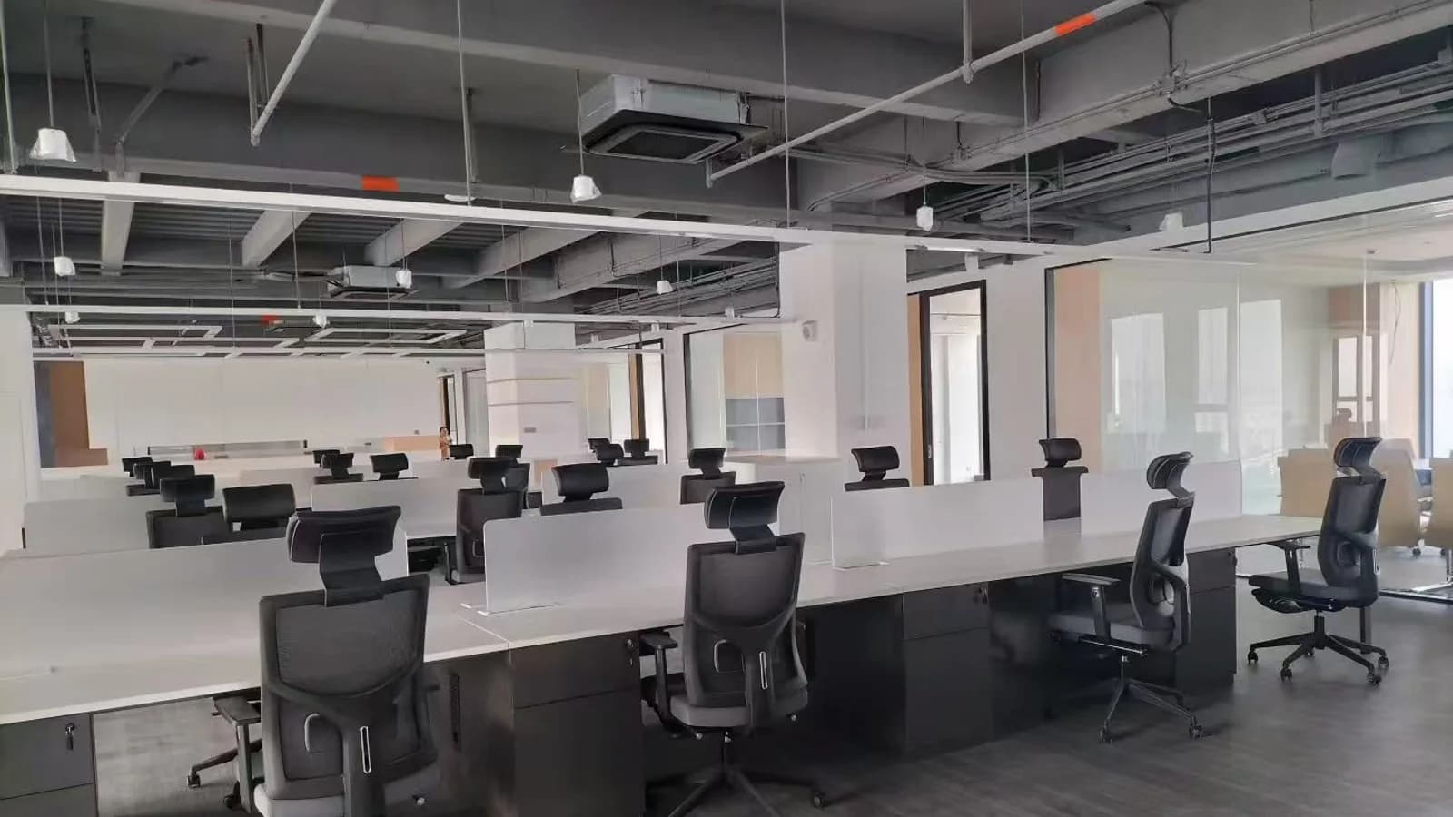MENBRO high-back office chairs arranged in a contemporary commercial workstation