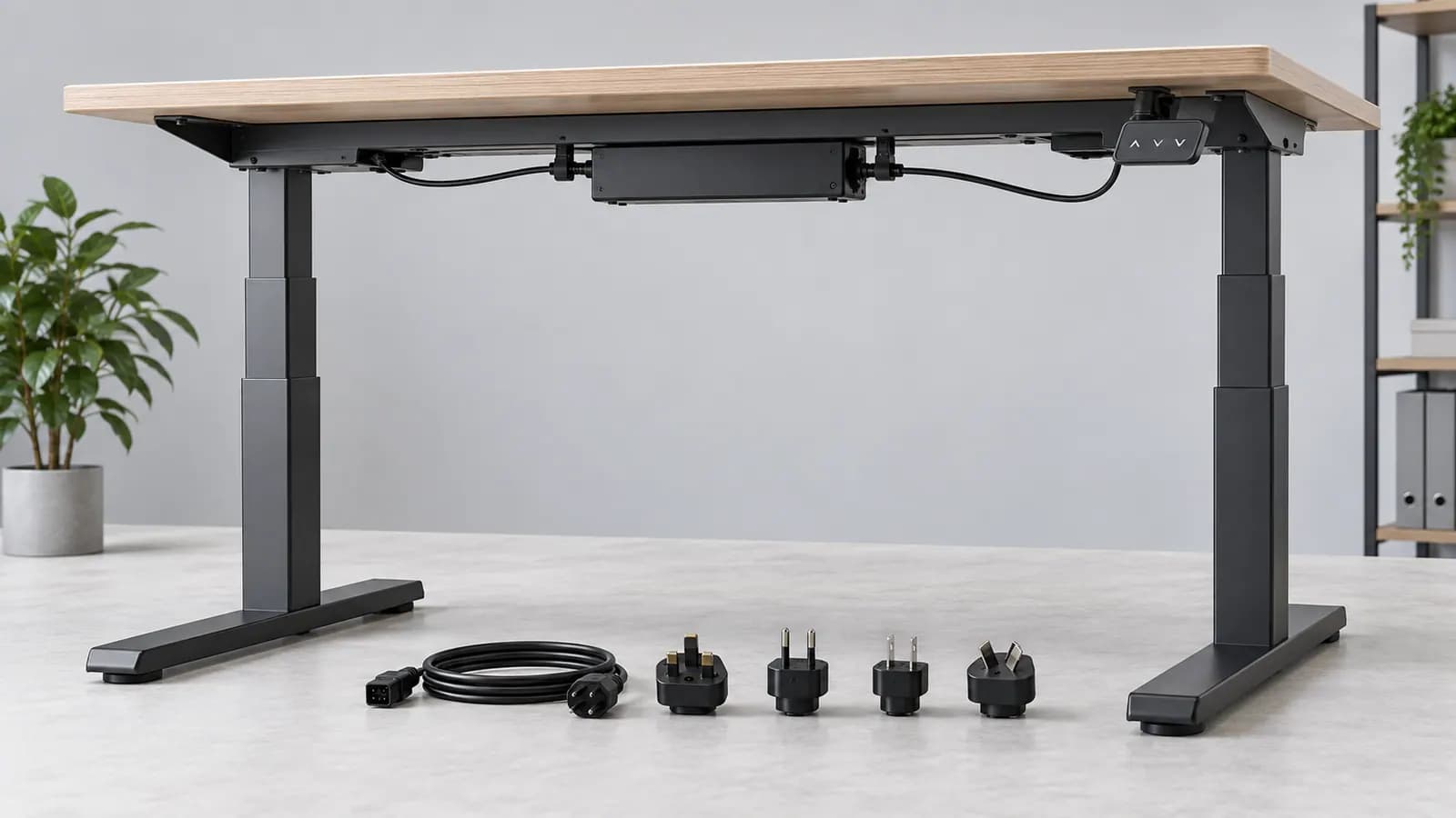 Unbranded electric standing desk with control system, detachable mains lead and generic destination plug samples arranged for review