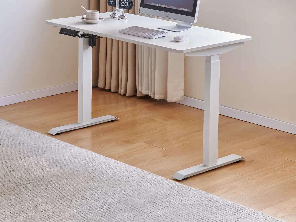 MENBRO height-adjustable desk control panel and telescoping columns shown in a furnished workspace for configuration review