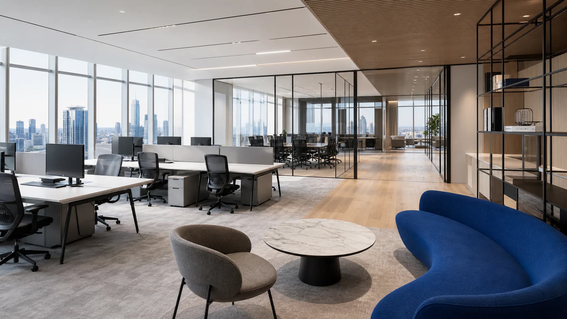Concept visualization of a high-rise corporate workplace with ergonomic chairs, workstations and a blue lounge sofa