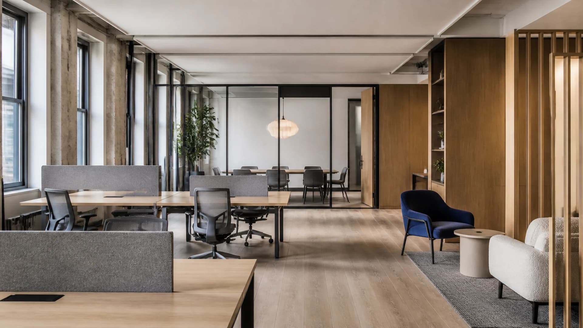 Concept visualization of a premium remodeled office with workstations, meeting room and lounge seating
