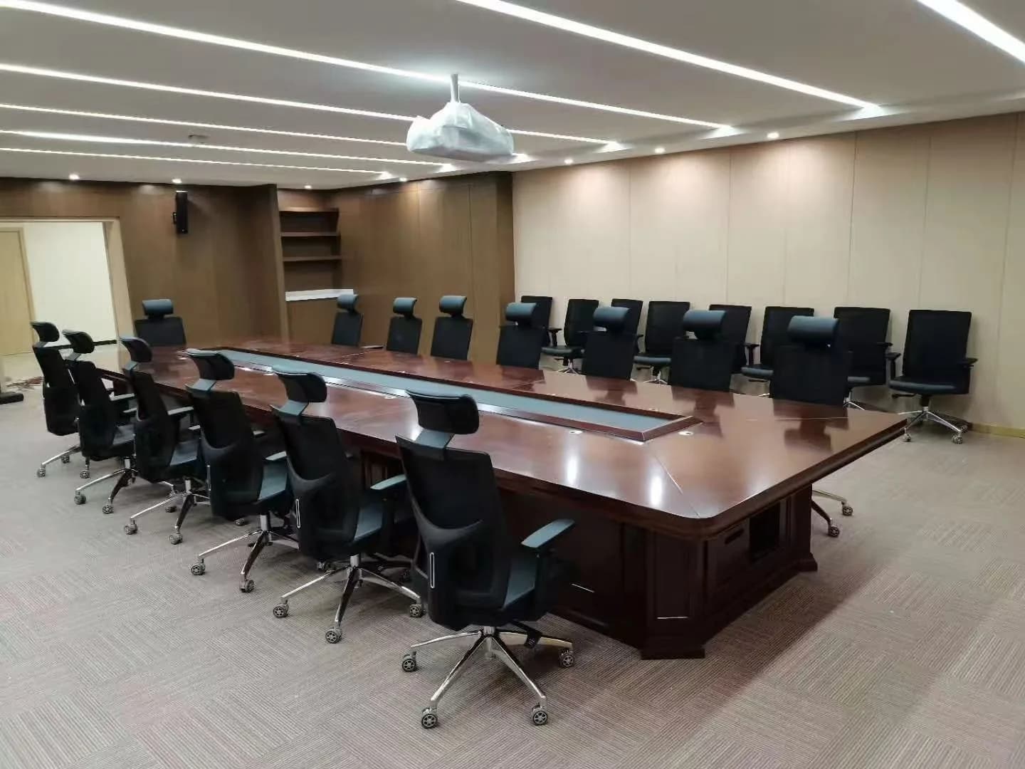 MENBRO office chairs arranged around a completed executive meeting table
