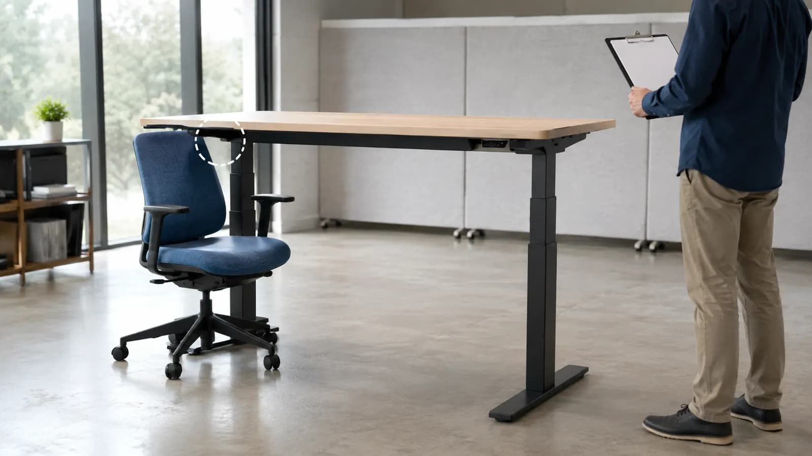 Unbranded electric standing desk undergoing a controlled anti-collision behavior review near an office chair